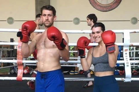 CMLocals Chiang Mai Locals Muay Thai ED Visa man and woman training in ring wearing gloves